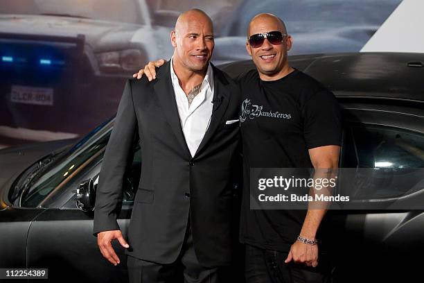 Dwayne Johnson and Vin Diesel pose for photographers during the premiere of the movie "Fast and Furious 5" at Cinepolis Lagoon on April 15, 2011 in...