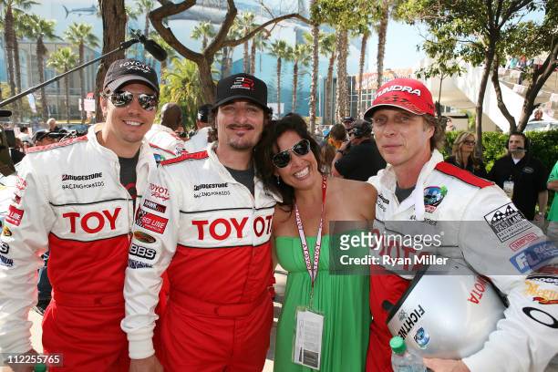 Actor Michael Trucco, actor Kim Coates, Denise Hartman and actor William Fichtner pose during the 35th Annual Toyota Pro/Celebrity Race at the Long...