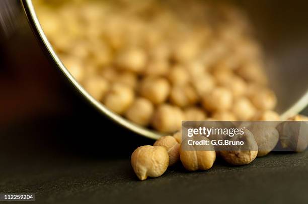 spilled chickpeas - chickpea stock pictures, royalty-free photos & images