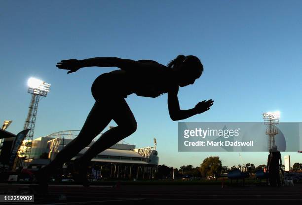 Competitor jumps out of the starting blocks in her heat of the Womens 400 Metres Open Semi Finals during day two of the Australian Athletics National...