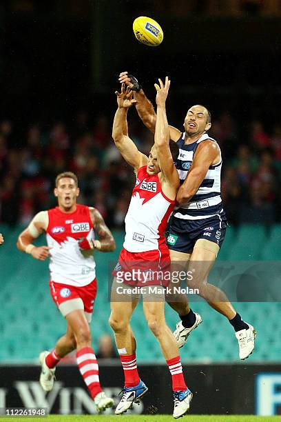 Ted Richards of the Swans and James Podsiadly of the Cats contest possession during the round four AFL match between the Sydney Swans and the Geelong...