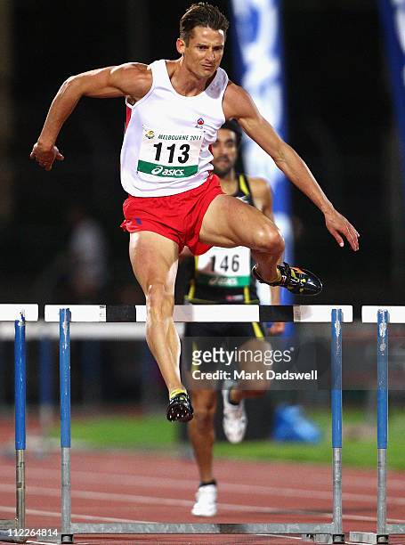 Brendan Cole of the AIS competes in the Mens 400 Metres Hurdles Open Final during day two of the Australian Athletics National Campionships at...