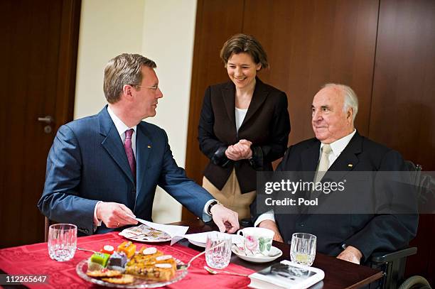 In this photo provided by the German Government Press Office German President Christian Wulff visits former German Chancellor Helmut Kohl and his...