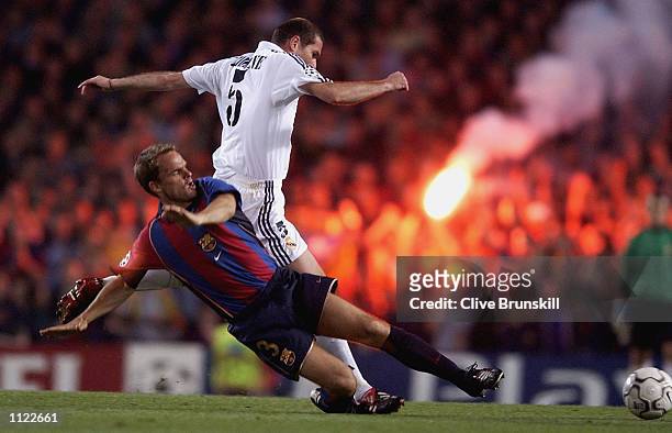 Frank De Boer of Barcelona tackles Zinedine Zidane of Real Madrid during the Barcelona v Real Madrid Champions League semi-final, first leg at the...