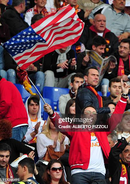 Roma team supporter waves a US flag prior to the Italian serie A football match opposing Roma and Palermo, at the Olympic stadium in Rome, on April...