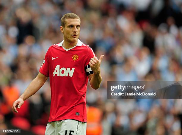 Nemanja Vidic of Manchester United gestures during the FA Cup sponsored by E.ON semi final match between Manchester City and Manchester United at...