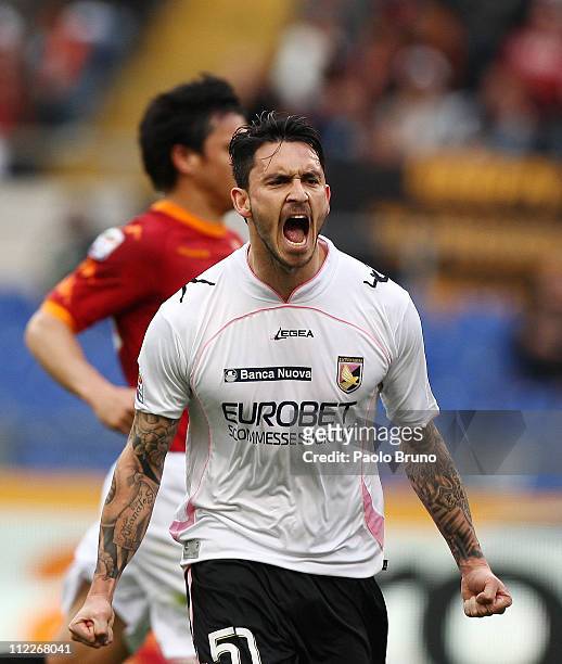Mauricio Pinilla of US Citta di Palermo celebrates after scoring the 1-1 equaliser from a penalty during the Serie A match between AS Roma and US...