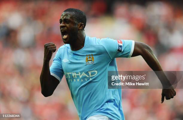 Yaya Toure of Manchester City celebrates scoring the opening goal during the FA Cup sponsored by E.ON semi final match between Manchester City and...