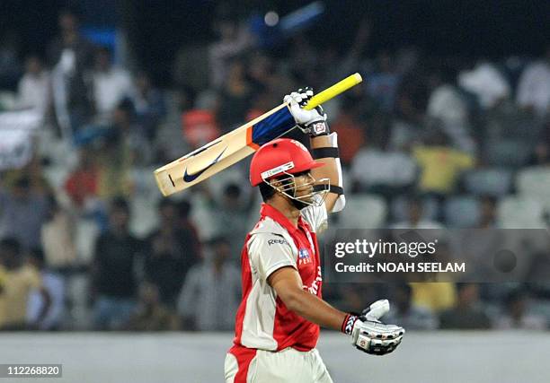 Kings XI Punjab batsman Paul Valthaty raises his bat for his fifty during the IPL twenty 20 match between Deccan Chargers and Kings XI Punjab at the...