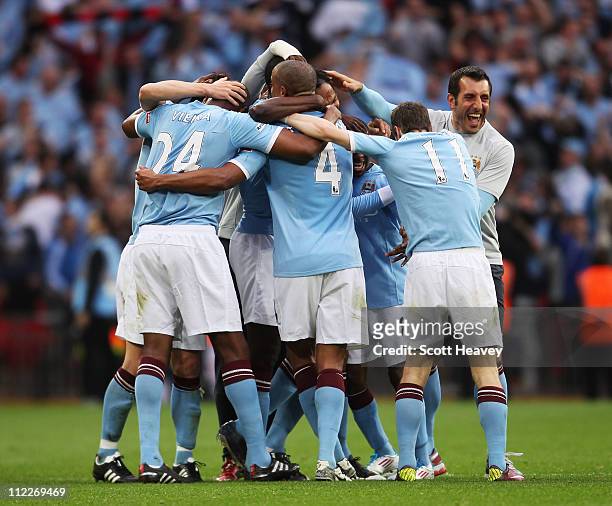 Man City players celebrate victory during the FA Cup sponsored by E.ON semi final match between Manchester City and Manchester United at Wembley...