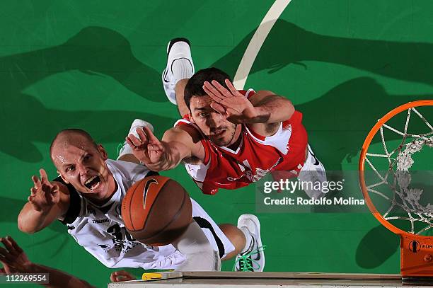 Maciej Lampe, #30 of Unics Kazan competes with Vedran Vukusic, #11 of Cedevita Zagreb during the Semifinal 1 Eurocup Finals Treviso 2011 between...