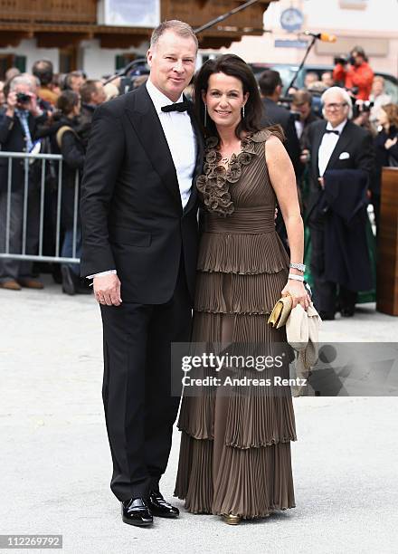 Stefan Reuter and wife Birgit Reuter arrive for the church wedding of Maria Hoefl-Riesch and Marcus Hoefl at the Pfarrkirche on April 16, 2011 in...