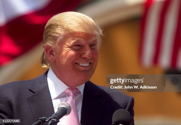 Billionaire Donald Trump laughs while speaking to a crowd at the 2011 Palm Beach County Tax Day Tea Party on April 16, 2011 at Sanborn Square in Boca...