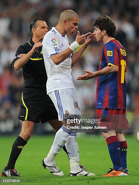 Pepe of Real Madrid argues with Lionel Messi of Barcelona during the la Liga match between Real Madrid and Barcelona at Estadio Santiago Bernabeu on...