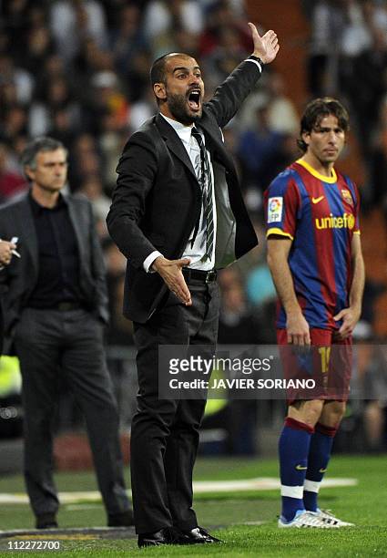 Barcelona's coach Josep Guardiola reacts during "El Clasico" Spanish League football match Real Madrid against Barcelona at the Santiago Bernabeu...