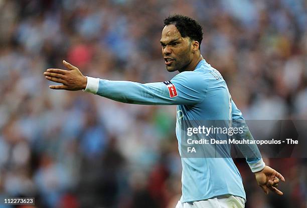 Joleon Lescott of Manchester City gives instructions during the FA Cup sponsored by E.ON semi final match between Manchester City and Manchester...