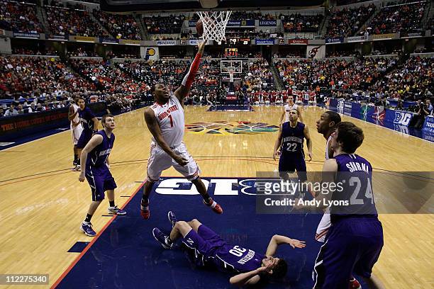 Deshaun Thomas of the Ohio State Buckeyes attempts a shot against Davide Curletti of the Northwestern Wildcats during the quarterfinals of the 2011...