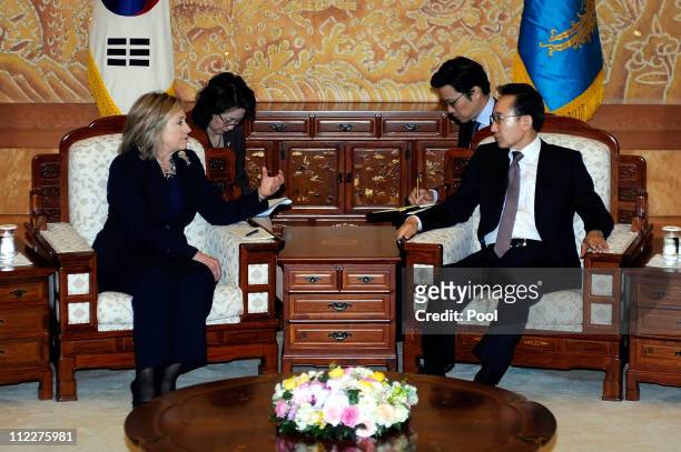 South Korean President Lee Myung-Bak talks with U.S. Secretary of State Hillary Clinton during their meeting at the Presidential House on April 17,...
