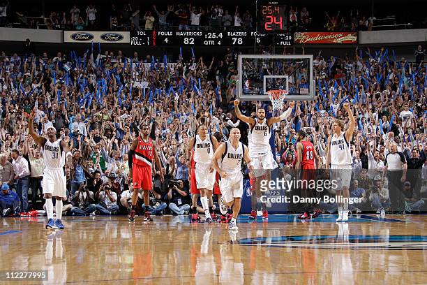 The Dallas Mavericks celebrate after Jason Kidd ices the game with a three point shot with 25 seconds left against the Portland Trail Blazers in Game...