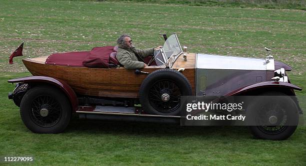 Vintage Rolls Royce owner Nick Channing drives his 1922 Silver Ghost car to be photographed at Northington Grange, the summer home of the Grange Park...