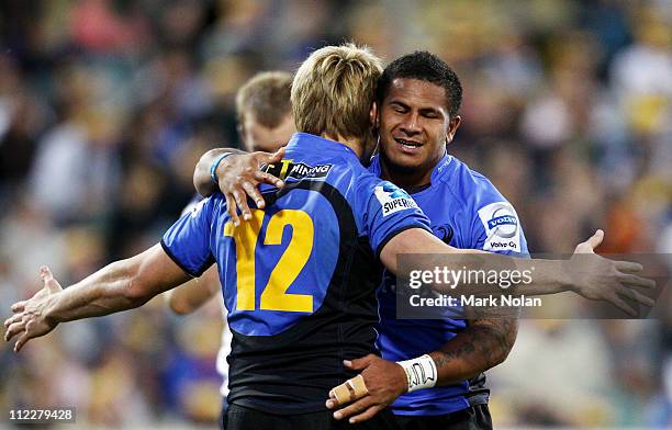 David Smith of the Force is congratulated by team mate James O'Connor after scoring during the round nine Super Rugby match between the Brumbies and...