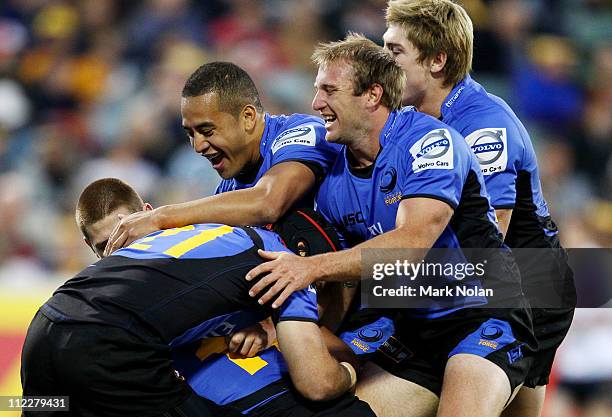 The Force celebrate a try by David Smith during the round nine Super Rugby match between the Brumbies and the Force at Canberra Stadium on April 17,...