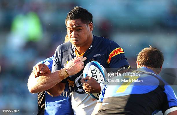Ita Vaea of the Brumbies is tackled during the round nine Super Rugby match between the Brumbies and the Force at Canberra Stadium on April 17, 2011...