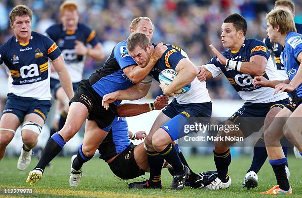 Brett Sheehan of the Force tackles Pat McCabe of the Brumbies during the round nine Super Rugby match between the Brumbies and the Force at Canberra...