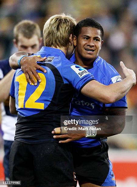 David Smith of the Force is congratulated by team mate James O'Connor after scoring during the round nine Super Rugby match between the Brumbies and...