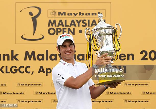 Matteo Manassero of Italy with the trophy after winning of the Maybank Malaysian Open at Kuala Lumpur Golf & Country Club on April 17, 2011 in Kuala...