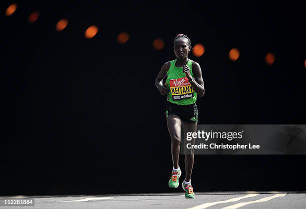 Mary Keitany of Kenya runs the London Marathon during the Virgin London Marathon 2011 on April 17, 2011 in London, England.