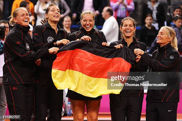 Anna-Lena Groenefeld, Andrea Petkovic, Sabine Lisicki, Julia Goerges, and coach Barbara Rittner of team Germany celebrate during the second day of...