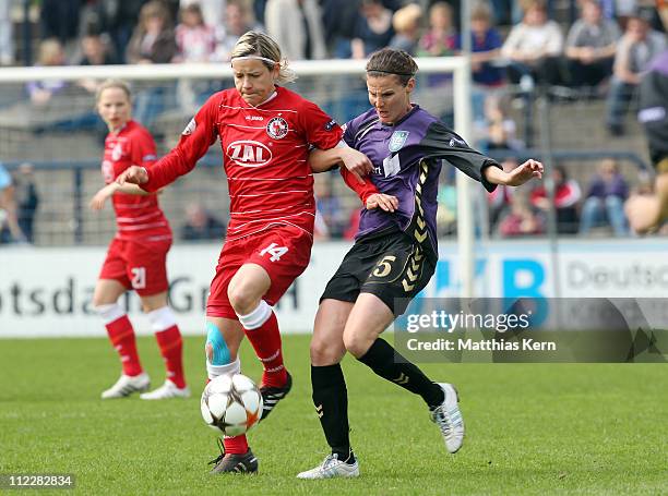 Jennifer Zietz of Potsdam competes for the ball with Jennifer Oster of Duisburg during the UEFA Women's Champions League semi-final second leg match...