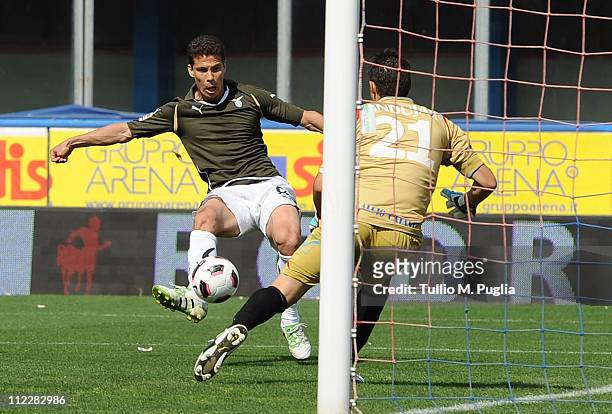 Hernanes of Lazio scores the opening goal past goalkeeper Mariano Andujar of Catania Calcio during the Serie A match between Catania Calcio and SS...