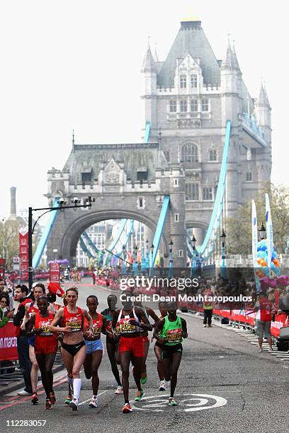 Mary Keitany of Kenya, Liliya Shobukhova of Russia and Edna Kiplagat of Kenya run over Tower Bridge during the Virgin London Marathon 2011 on April...