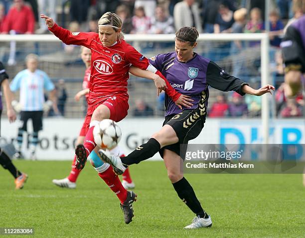 Jennifer Zietz of Potsdam competes for the ball with Jennifer Oster of Duisburg during the UEFA Women's Champions League semi-final second leg match...