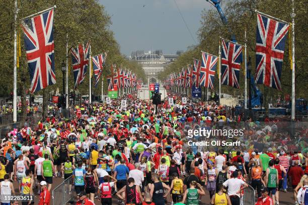 Runners finish the 2011 Virgin Money London Marathon on the Mall on April 17, 2011 in London, England. 36,500 competitors will tackle the 26.2 mile...