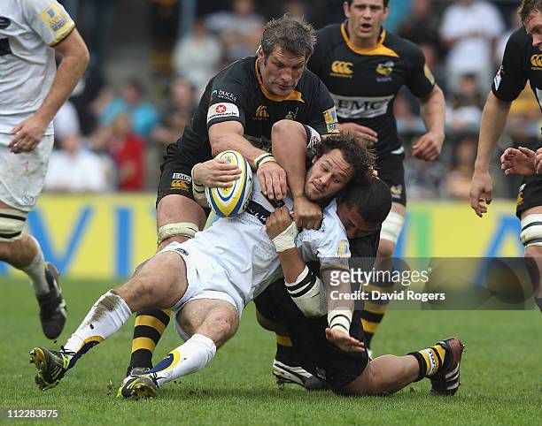 Scott Mathie of Leeds is tackled by Simon Shaw and Zak Taulafo during the Aviva Premiership match between London Wasps and Leeds Carnegie at Adams...