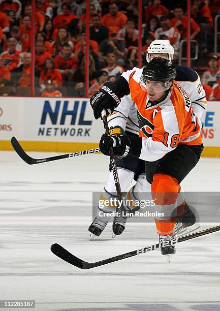 Mike Richards of the Philadelphia Flyers shoots the puck against the Buffalo Sabres in Game One of the Eastern Conference Quarterfinals during the...