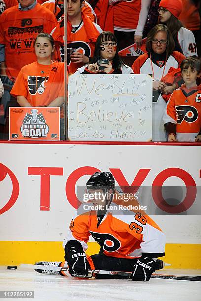 Darroll Powe of the Philadelphia Flyers stretches as the fans show their support during warm ups against the Buffalo Sabres in Game One of the...