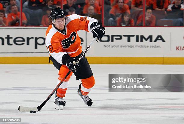 Claude Giroux of the Philadelphia Flyers skates with the puck against the Buffalo Sabres in Game One of the Eastern Conference Quarterfinals during...