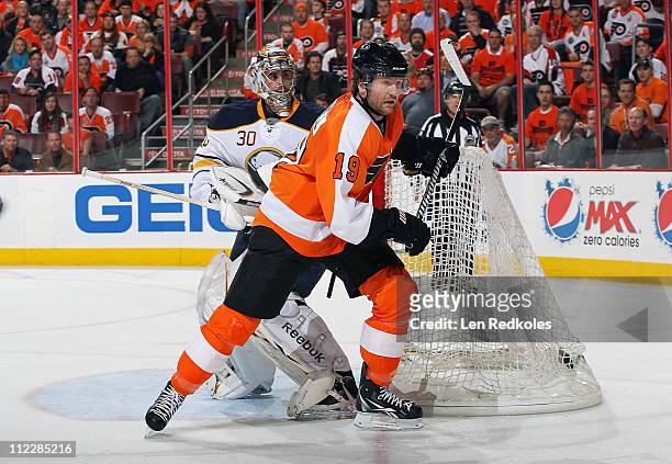 Scott Hartnell of the Philadelphia Flyers skates past goaltender Ryan Miller of the Buffalo Sabres in Game One of the Eastern Conference...