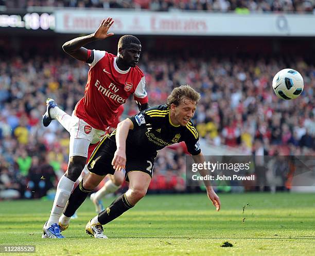 Emmanuel Eboue of Arsenal brings Lucas Leiva of Liverpool in the box for a penilty during the Barclays Premier League match between Arsenal and...