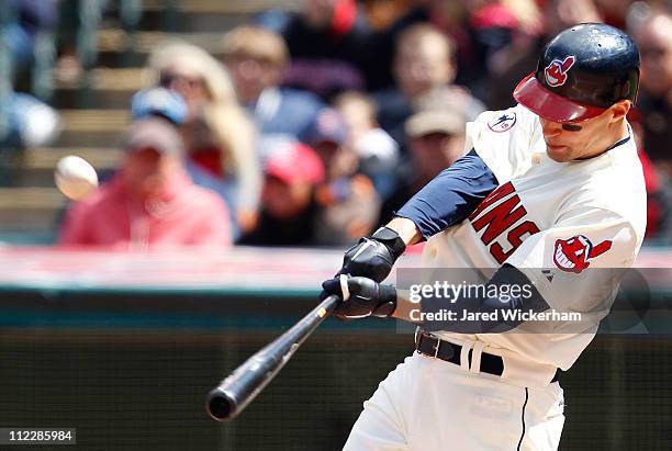 Grady Sizemore of the Cleveland Indians hits a solo home run against the Baltimore Orioles during the game on April 17, 2011 at Progressive Field in...