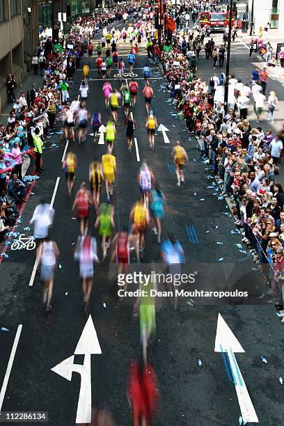 Competitors run past St Magnus the Martyr, London Bridge during the Virgin London Marathon 2011 on April 17, 2011 in London, England.