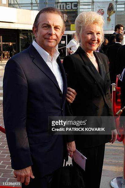 French actor Roland Giraud and his wife French actress Maaike Jansen pose as they arrive for the 25th Molieres theatre award ceremony on April 17,...