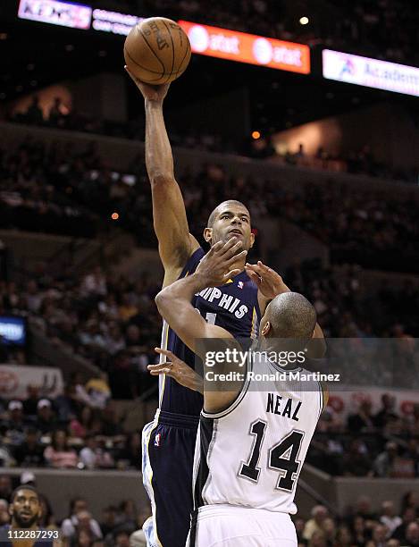 Forward Shane Battier of the Memphis Grizzlies takes a shot against Gary Neal of the San Antonio Spurs in Game One of the Western Conference...