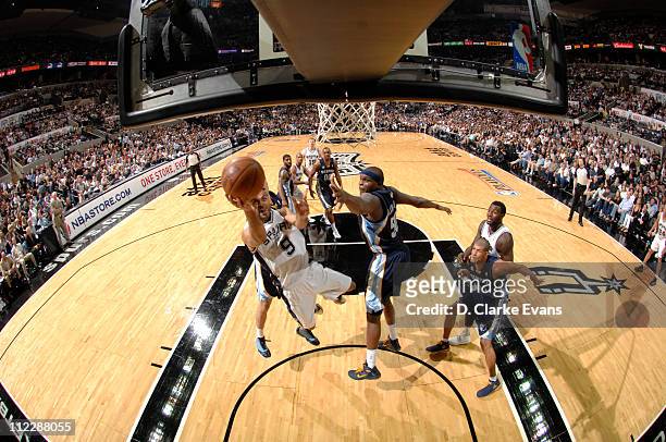 Tony Parker of the San Antonio Spurs shoots against Zach Randolph of the Memphis Grizzlies in Game One of the Western Conference Quarterfinals in the...
