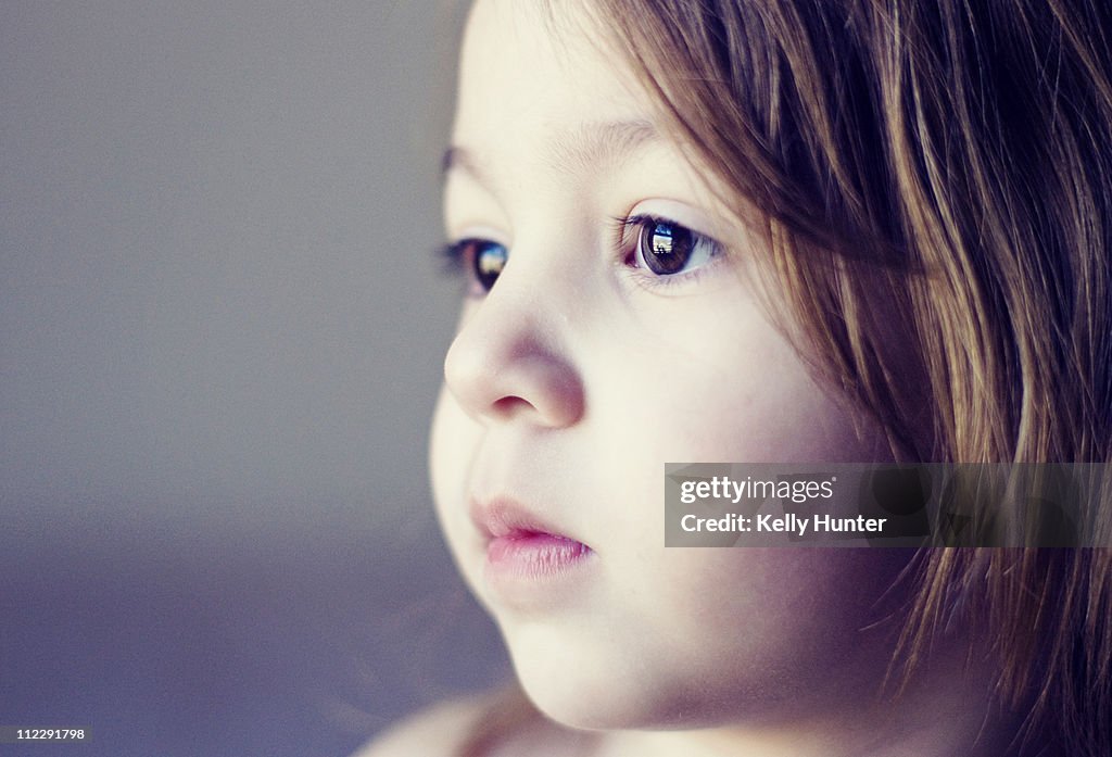 Girl child gazes out