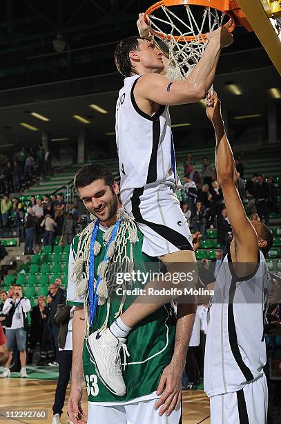 Petr Samoylenko, #9 of Unics Kazan, Slavko Vranes, #33 and Kelly McCarty, #21 during the 2011 Eurocup Champion Award Ceremony at Palaverde Arena on...